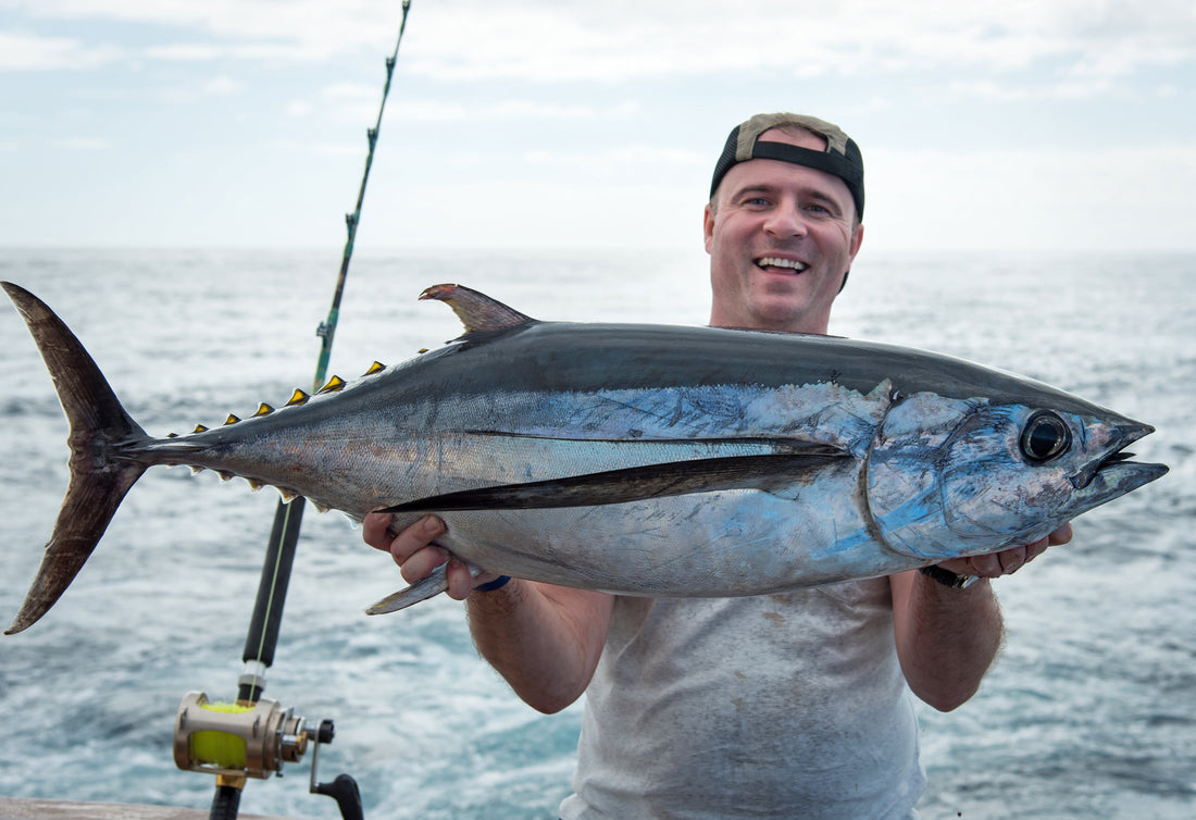 man holding large fish 