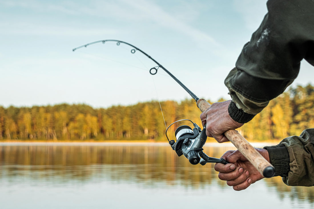 fishing rod and reel on a lake