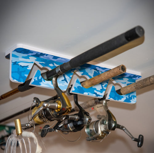 Fishing rod and reels on a blue camouflage holder mounted on the ceiling