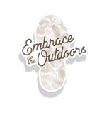 Sticker with 'Embrace the Outdoors' text and nature-themed design on a white background