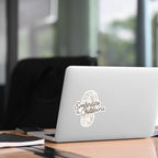 Laptop with 'Embrace the Outdoors' sticker on a desk in an office setting