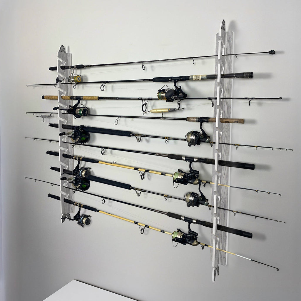 Wall-mounted fishing rod holder with multiple fishing rods on a gray wall.